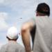 Canton residents Ryan and Glenn Clark watch their miniature RC plane do aerial tricks as a plane flies above at the Flying Pilgrims Radio Control Club event on Sunday. Daniel Brenner I AnnArbor.com